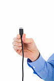 Businessman holding a cable