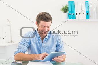 Casual businessman using tablet