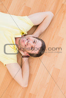 A man lying on floor at home