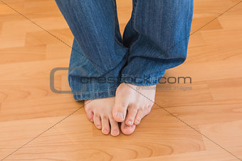 Mens feet on wooden floor