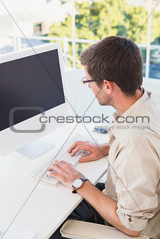 Casual businessman working at his desk