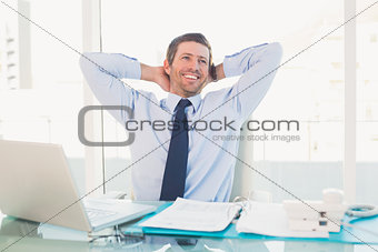 Relaxing businessman at his desk