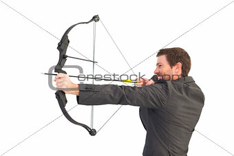 Handsome businessman shooting a bow and arrow