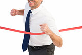 Businessman smiling and crossing the line
