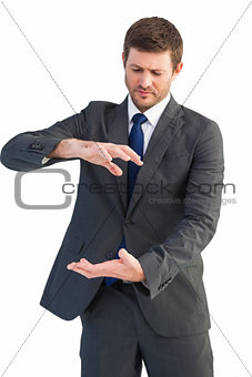 Businessman showing something with his hands