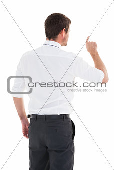 Handsome businessman pointing at a copy space