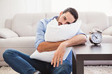 Exhausted man sleeping with head resting on pillow