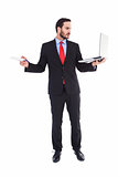 Handsome businessman holding his laptop