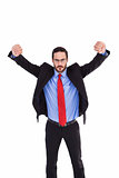 Unsmiling businessman standing with arms raised
