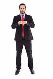 Unsmiling businessman with clenched fist in front of him