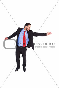 Serious businessman in suit gesturing with hand