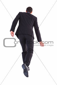 Rear view of businessman walking