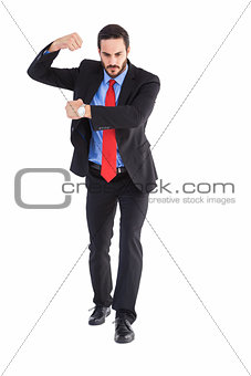 Focused businessman holding something with his hands