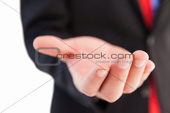 Businessman presenting with his hand