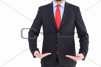 Businessman presenting your product with hands