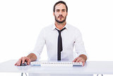 Focused businessman working on computer