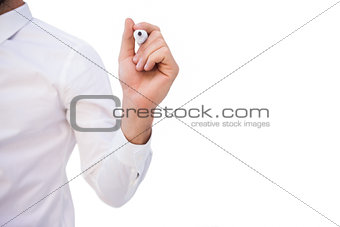 Mid section of businessman writing with marker