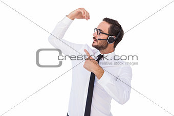 Businessman wearing a headset while showing something