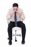 Businessman sitting on swivel chair shouting