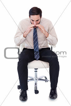 Businessman sitting on swivel chair shouting