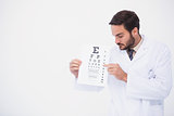 Doctor in lab coat showing eye test