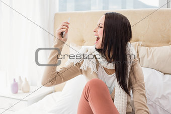 Angry brunette shouting at her phone