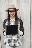 Pretty hipster showing tablet pc