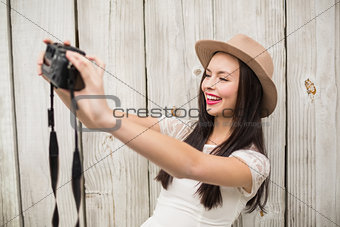 Pretty brunette taking a selfie