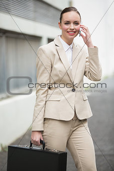 Young businesswoman talking on phone