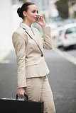 Young businesswoman talking on phone