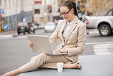 Young businesswoman using her laptop