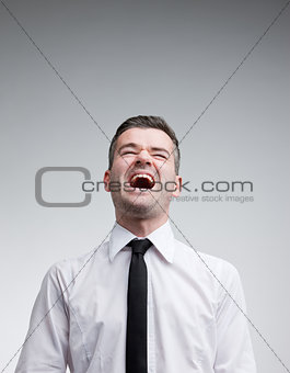 man laughing out loud with a necktie