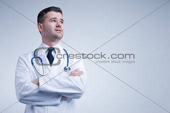 doctor looking up thinking or worried