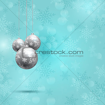 Christmas baubles on snowflake background 