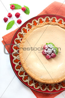 Coffee and cream cake with raspberries