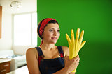 Young Hispanic Woman With Yellow Latex Gloves Cleaning Home