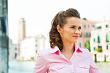 Portrait of young woman on grand canal in venice, italy