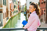 Portrait of happy young woman in venice, italy