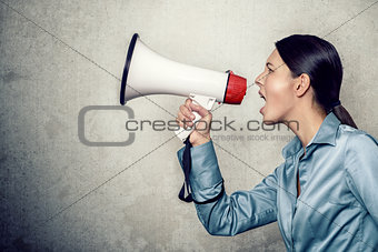 Young Woman Shouting with Megaphone