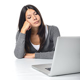 Bored businesswoman staring at her laptop computer