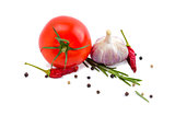 Tomato, garlic, chili peppers and rosemary isolated on white background.