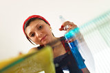Hispanic Girl Maid At Home Doing Chores Cleaning Glass Table