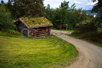 Countryside landscape with ancient old historic wooden house in Norway