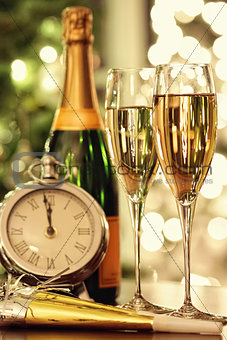 Glasses of champagne with festive background