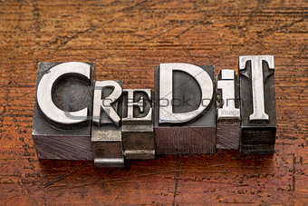 credit word in metal type