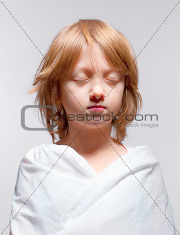 Portrait of a Boy with Closed Eyes - Isolated on Gray