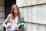 Beautiful female student with book