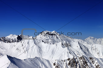 Snowy mountains in sun day