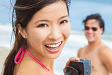 Asian Woman Couple at Beach Taking Video or Photograph