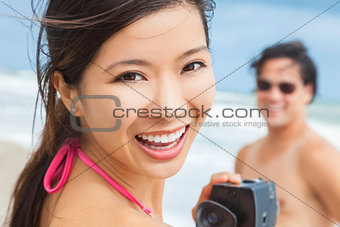 Asian Woman Couple at Beach Taking Video or Photograph